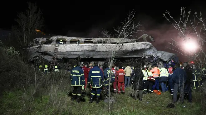 Rescue workers and emergency personel search the wreckage