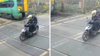 The moped crossing the tracks