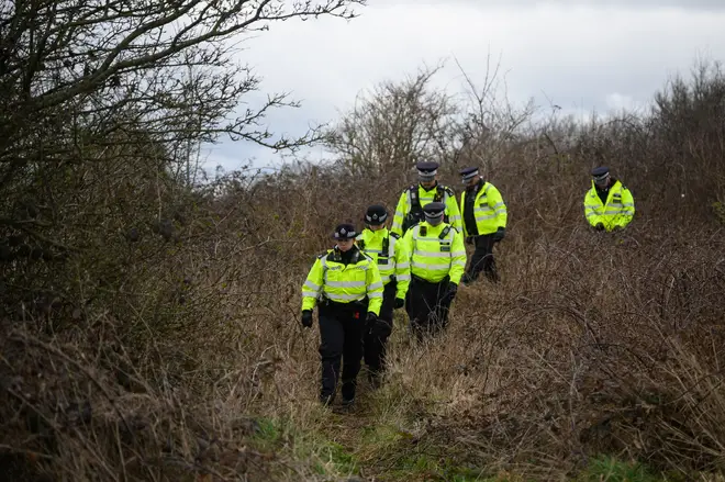 A police search team works through a woodland area in the search for Constance Marten's missing baby on March 01, 2023 in Brighton, England.