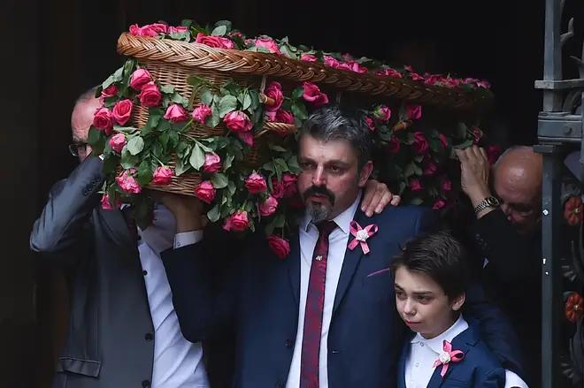 affie-Rose Roussos, Andrew (C) and Saffie's brother Alexander (2R), carry her coffin out of the church following Saffie's funeral