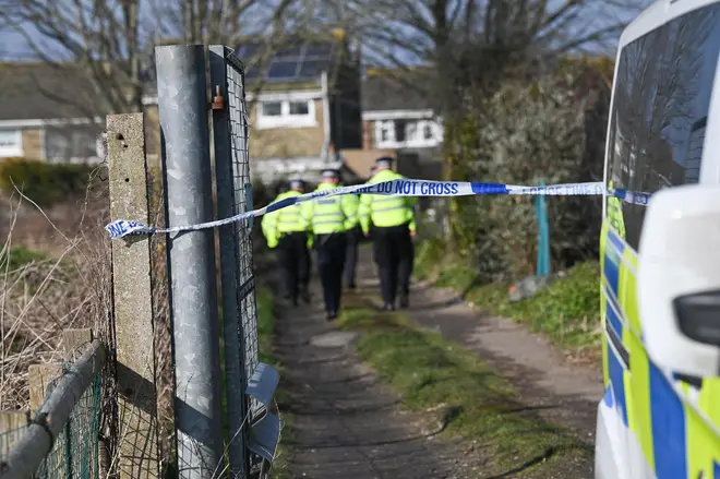 Police officers at the entrance to allotments near Hollingbury Golf Course in Brighton where found the remains of a baby 