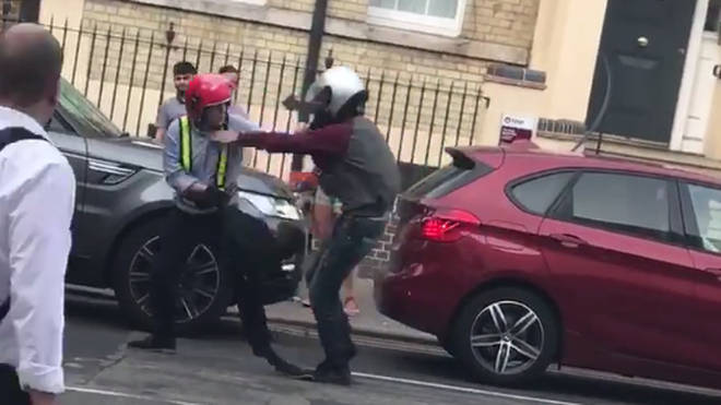 Footage shows the attacker wrestling the scooter rider to the ground.
