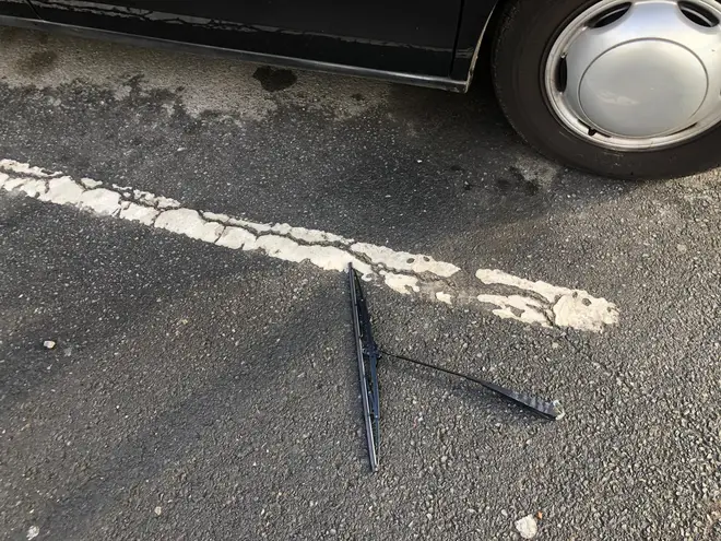 The windscreen wiper ripped off and thrown to the floor