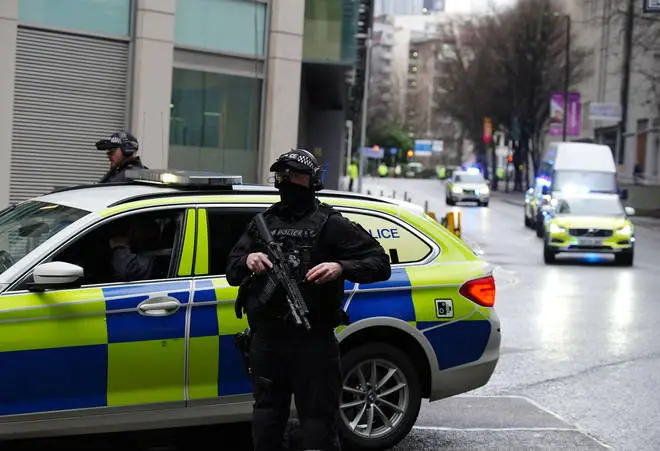Armed police outside court as the trial got under way