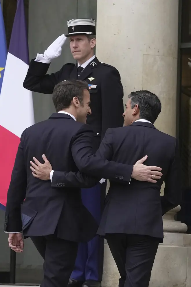 Rishi Sunak and Emmanuel Macron going into the Elysee Palace