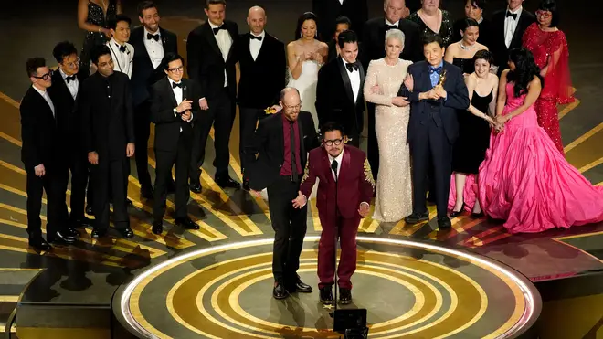 The cast and crew of "Everything Everywhere All at Once" accepts the award for best picture