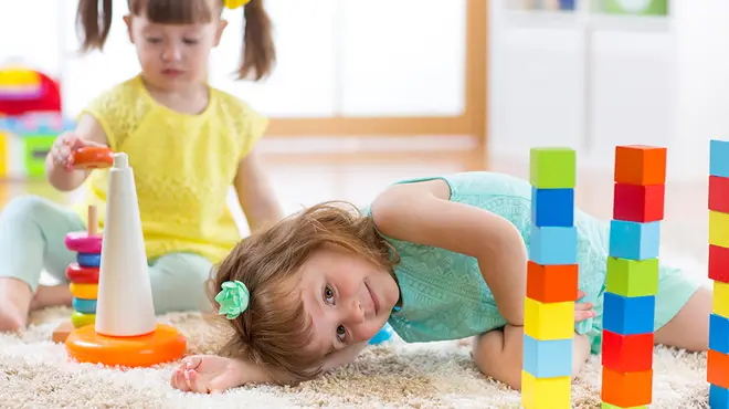 Children playing with building bricks at childcare setting