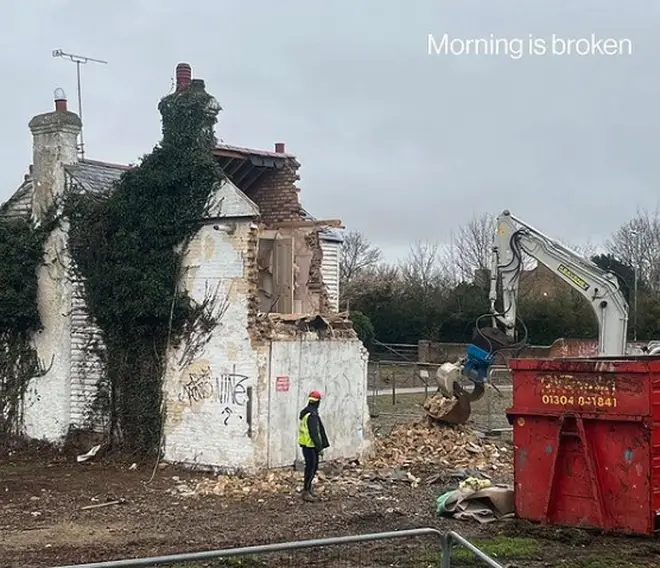 Builders who were working on the site, who can be seen demolishing the wall as part of the montage, have said they "felt sick"  after learning of the artist behind the mural.