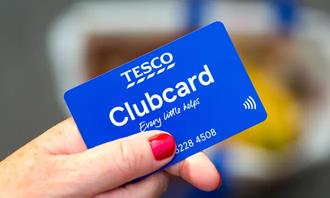 Tesco's physical Clubcard in woman's hands