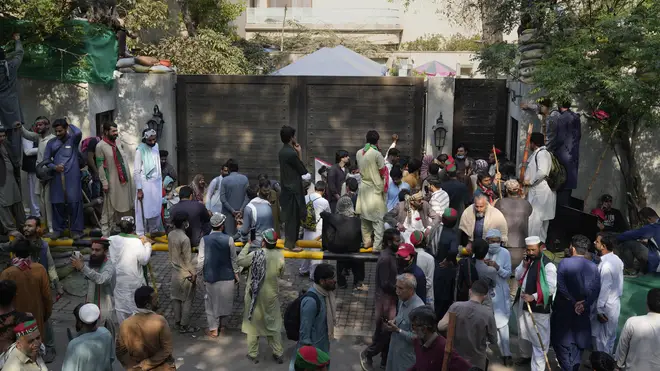 Supporters of former Pakistan prime minister Imran Khan gather outside his residence in Lahore