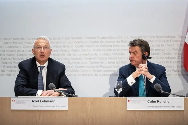 Credit Suisse chairman Axel Lehmann (L) and UBS Chairman Colm Kelleher address a press conference after talks over UBS taking over its rival Swiss bank Credit Suisse in Bern on March 19, 2023.