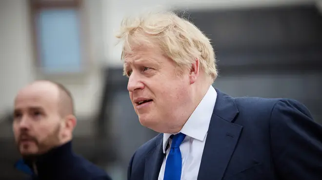 Boris Johnson's wearing a blue tie outside