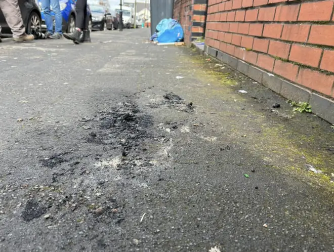 The scorched pavement after the attack in Birmingham