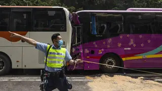 A policeman at the scene of a crash in Hong Kong