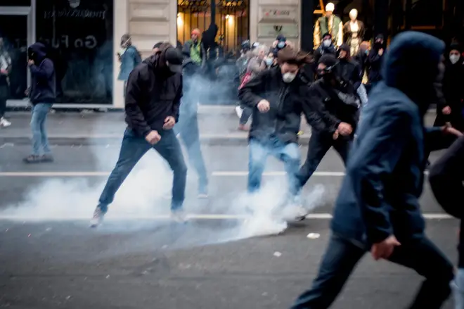 Police fire tear gas at protesters in Paris