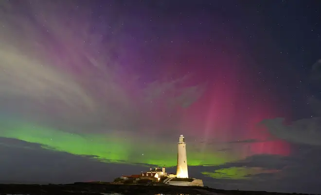 The aurora borealis, also known as the northern lights, glow on the horizon at St Mary's Lighthouse in Whitley Bay on the North East coast. Picture date: Thursday March 23, 2023. Photo credit should read: Owen Humphreys/PA Wire