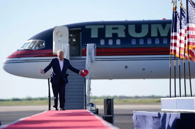 Trump walks to the stage from his plane, dubbed 'Trump Force One'