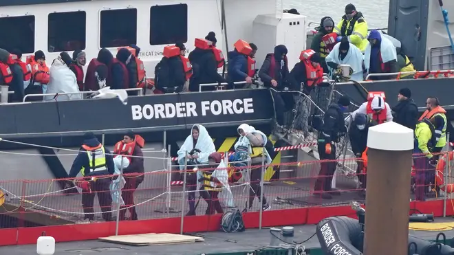 Channel migrants are pictured being processed in Dover