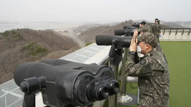 South Korean army soldiers watch the North Korea side from the Unification Observation Post in Paju, South Korea, on Friday, March 24, 2023.