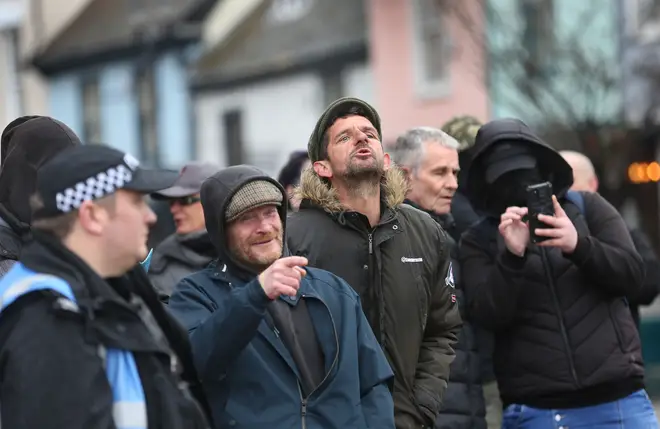 Protesters opposed to asylum seekers being put in city centre hotels taunt counter protesters outside the Novotel on March 18, 2023 in Ipswich, United Kingdom.