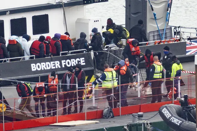 Migrants including women and children are removed from a Border Force vessel after being picked up in the Channel on March 06, 2023 in Dover, England.