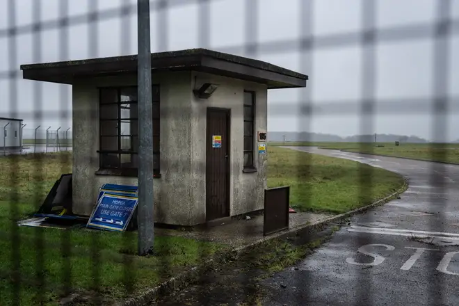 A disused guard box is pictured behind a gate on the perimeter fence at MDP Wethersfield.