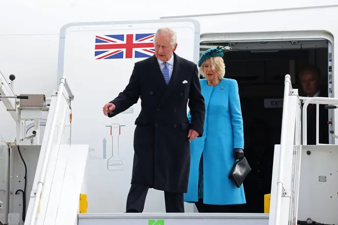 King Charles and Queen Consort Camilla step off the plane at Berlin's Brandenburg Airport