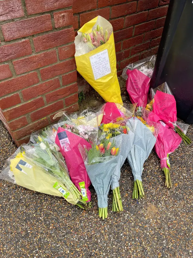 Flowers left at the scene at The Row in Sutton, near Ely, Cambridgeshire