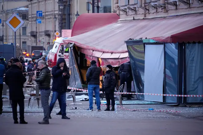 Russian investigators and police officers at the scene.