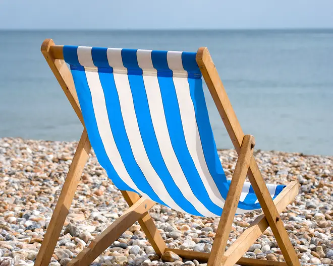 Blue and white striped deckchair on Brighton beach