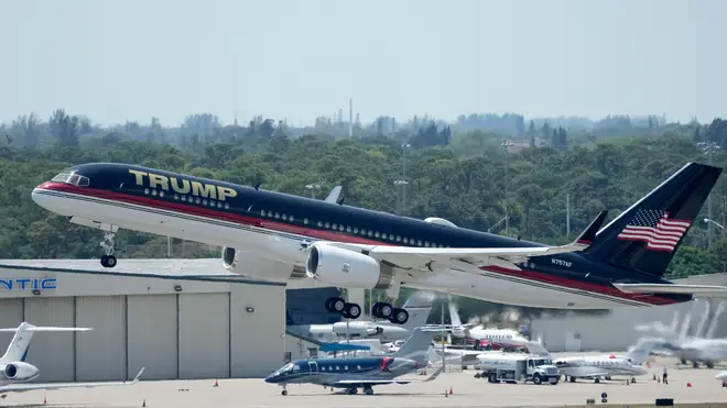 The plane carrying former president Donald Trump lifts off at Palm Beach International Airport,