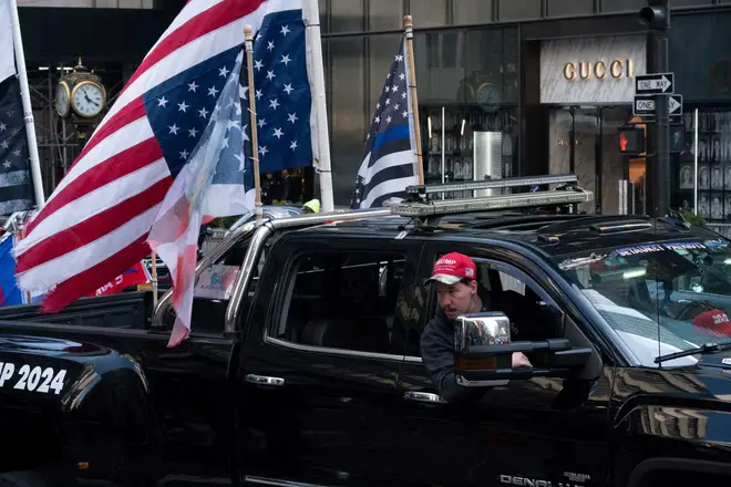 Supporters of former US president Donald Trump drive down Fifth Avenue