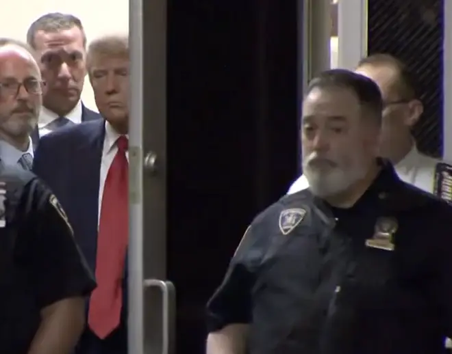 One of the court officers entered ahead of Trump and didn't hold the door open for him