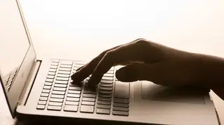 Woman uses laptop
