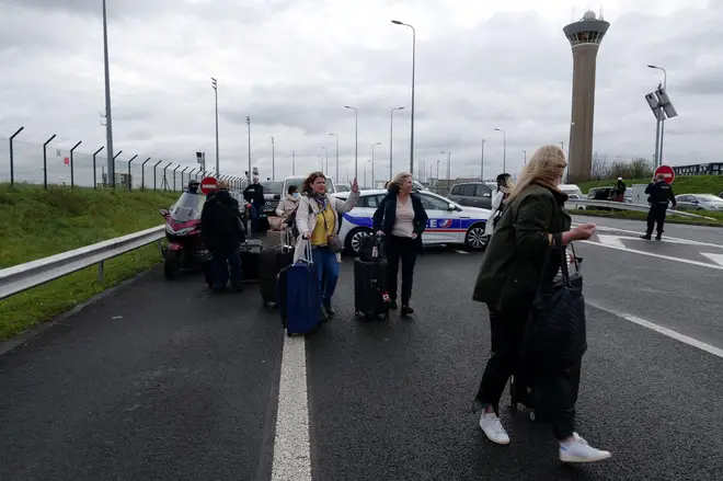 Passengers were forced to walk the last mile to Charles de Gaulle airport amid strikes in France