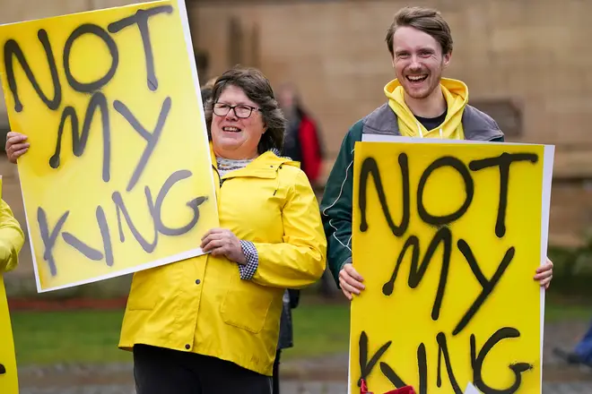 Anti-Monarchy protestors demonstrate at the service