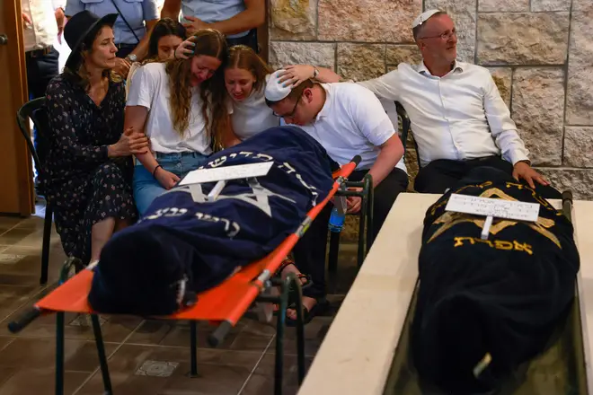 Relatives react during the funeral of British-Israeli sisters Rina and Maya Dee at the Kfar Etzion settlement cemetery in the occupied West Bank, on April 9, 2023.