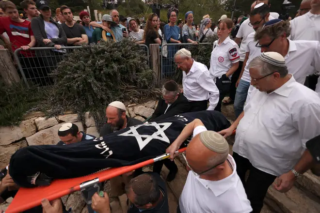 Mourners at the funeral on Sunday