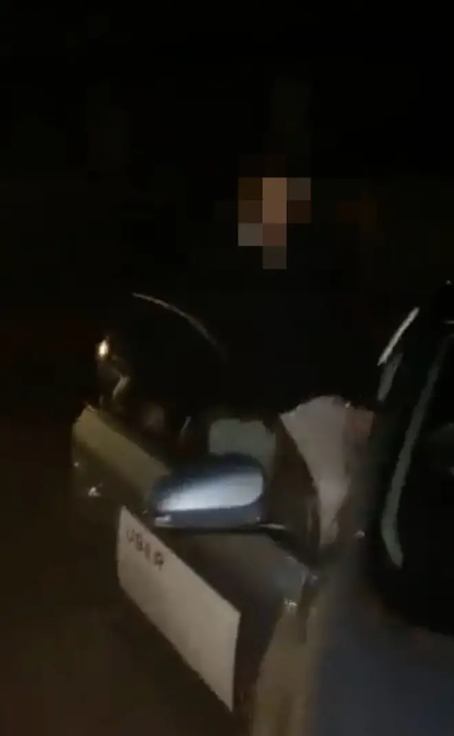 The driver pulled up his trousers and moved into the driver's seat after being spotted