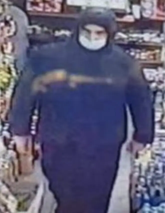 Still from CCTV footage showing Mosa in a shop the day he fled
