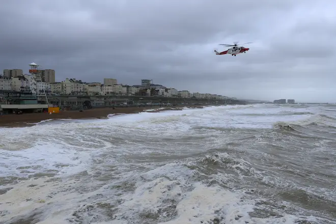 A coastguard helicopter scours the rough sea off the Brighton after the search was launched