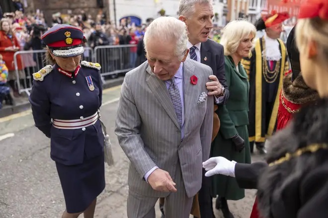 Charles reacts after an egg is thrown is his direction during the walkabout
