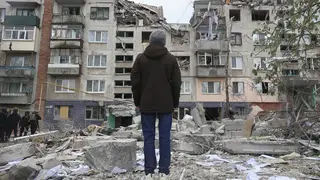 A local resident looks at his home, which was damaged a Russian rocket attack in Sloviansk, Donetsk region, Ukraine, on Friday