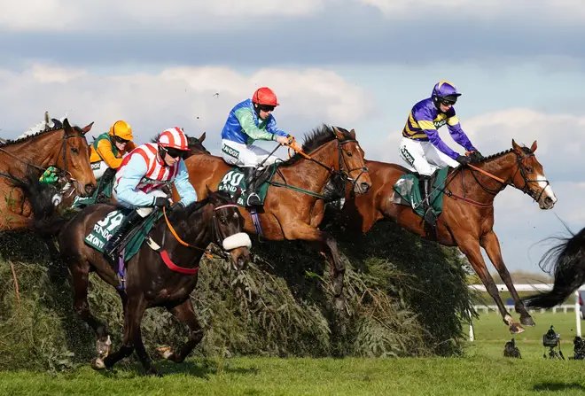 Riders compete during the Randox Grand National Handicap Chase