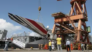 Workers unload debris from crashed Air France Flight 447 in Recife, Brazil, in June 2009