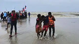 Rescuers help a survivor