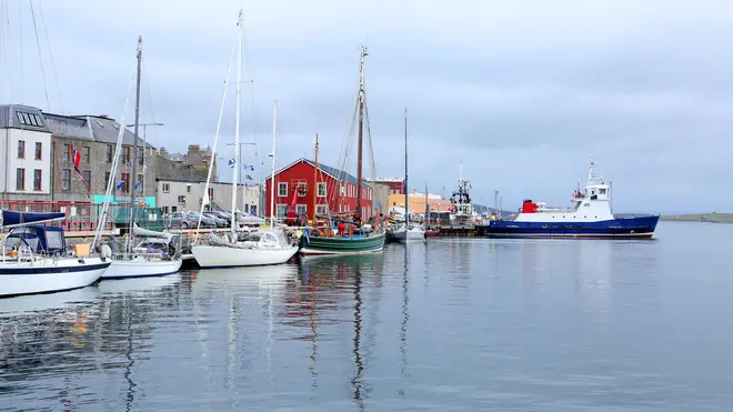 Harbour with fishing boats, lifeboat & buildings in the background, Lerwick, Shetland Islands, Scotland.