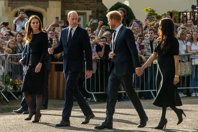 New reports say the walk was a 'very difficult' interaction for the Sussexes.