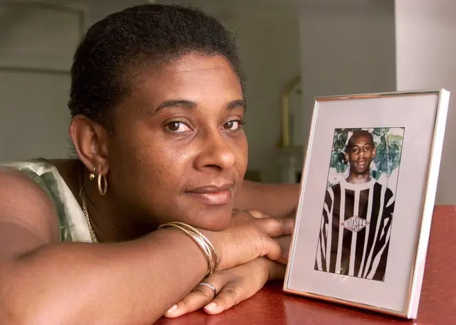 Doreen Lawrence with a photograph of her murdered son Stephen Lawrence