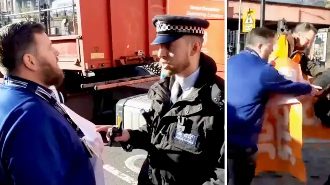 Man receives warning from police officer over trying to move just stop oil protesters.